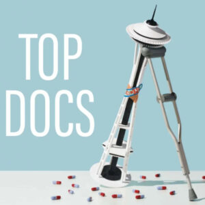 An image of the Space Needle with two bandages on it leaning on a crutch with several capsules underneath it. The text reads: top docs.